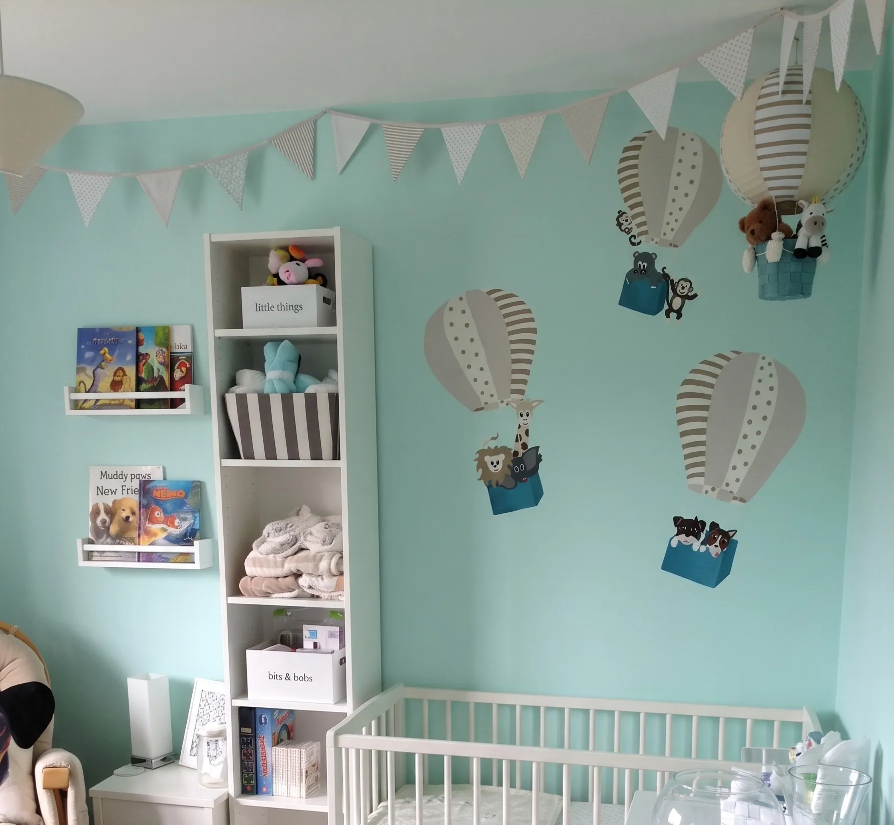 Hot Air Balloon Nursery: A mini mural for a nursery, building on its hot air balloon theme with a balloon-borne menagerie of animals, including the family's own pets.